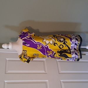 Purple, gold,and black dress reminds me of Mardi Gras colors